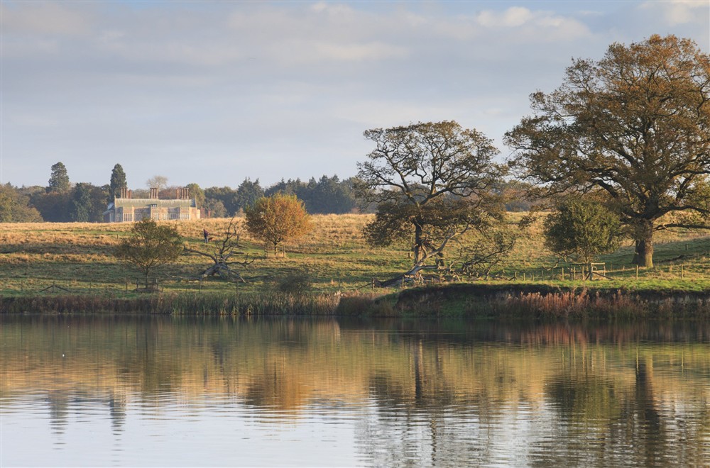 Autumnal view of the lake and parkland with Felbrigg Hall in the distance, Norfolk. at Cromer Lodge in Norwich, Norfolk