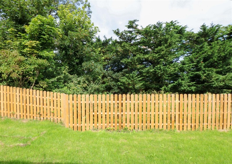 The garden at Cromlech Cottage at Cromlech Manor Farm, Tyn-y-Gongl near Benllech