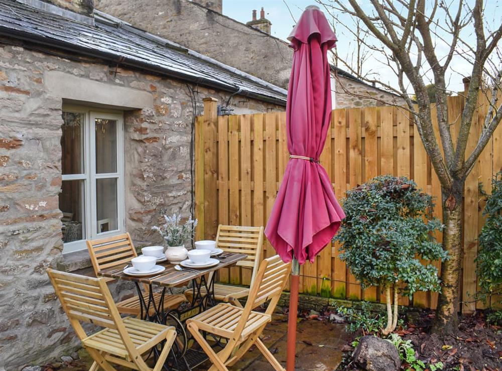 Outdoor eating area at Cross House Cottage in Carnforth, Lancashire