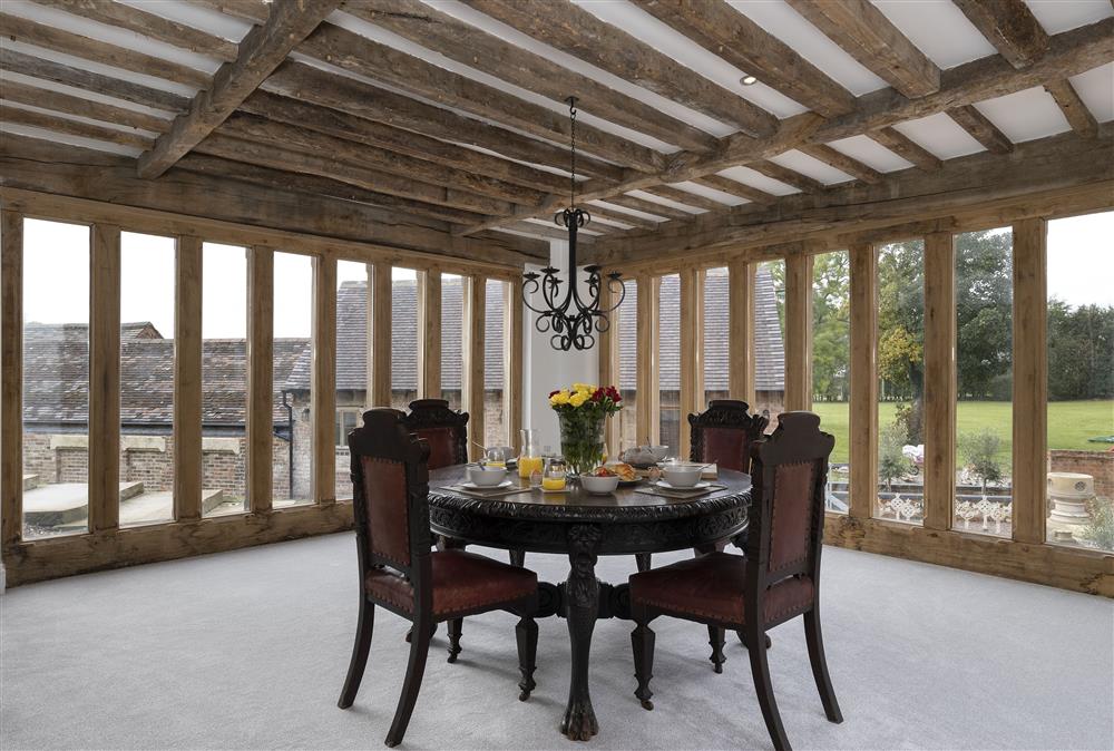 Dining room with feature windows at Crossbrook Farm, Finstall nr Bromsgrove