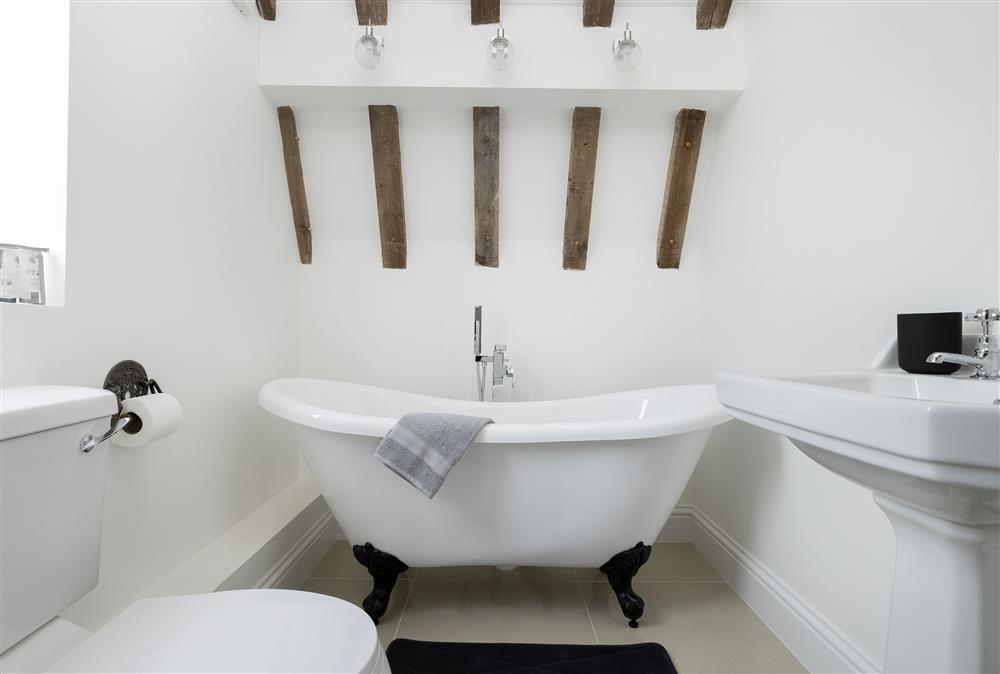 En-suite bathroom with double ended slipper bath and hand-held shower attachment at Crossbrook Farm, Finstall nr Bromsgrove