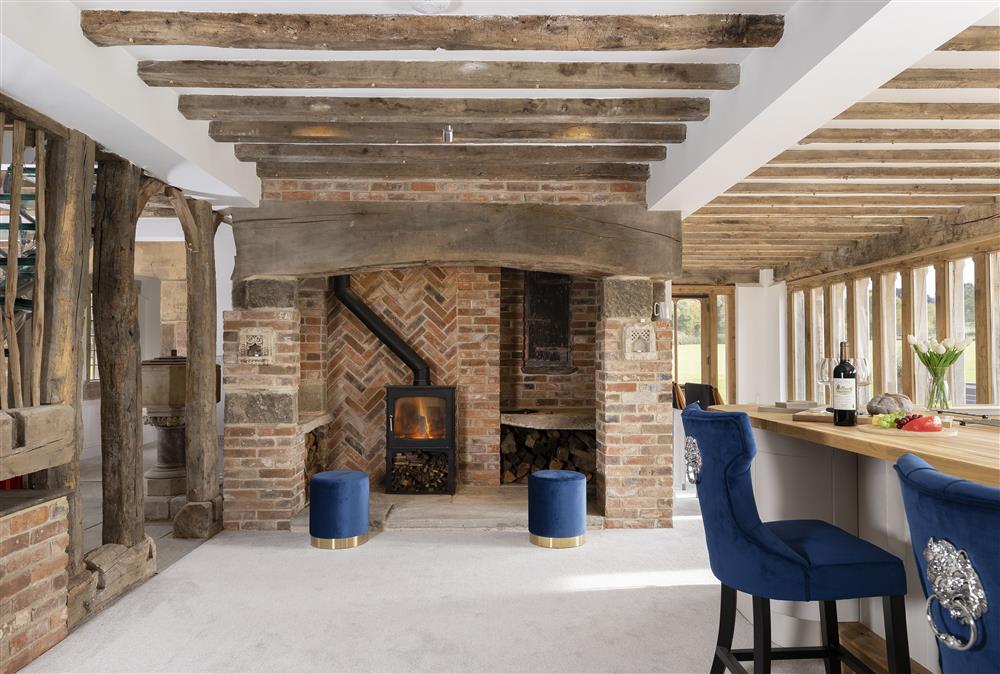 Open-plan living space with a wood burning stove
