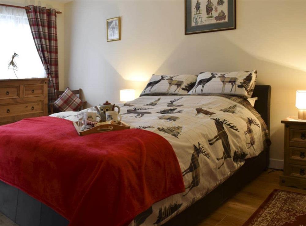 Cosy bedroom with doubled bed at Crossburn Hideaway in Arden, near Helensburgh, Argyll and Bute, Dumbartonshire