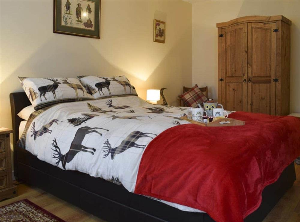 Tastefully furnished bedroom with double bed at Crossburn Hideaway in Arden, near Helensburgh, Argyll and Bute, Dumbartonshire