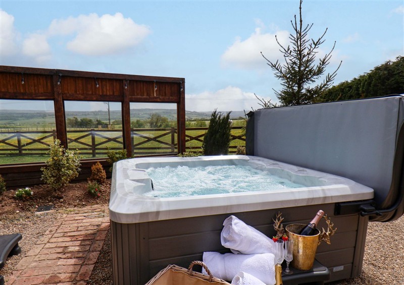 There is a hot tub (photo 2) at Crossbutts Farmhouse, Whitby