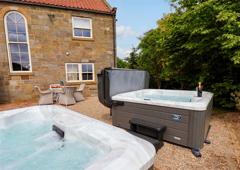 There is a hot tub (photo 3) at Crossbutts Farmhouse, Whitby