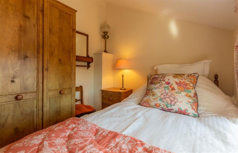 First floor:  Bedroom 3 with a small double 4ft bed and large wardrobe at Crown Villa, Wells-next-the-Sea