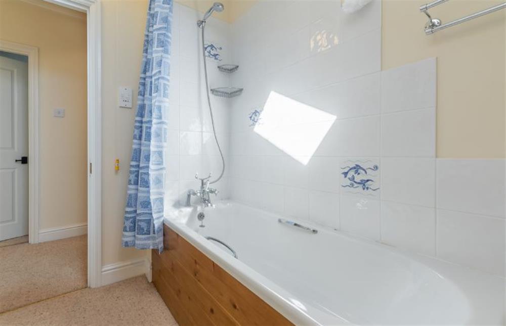 First floor:  Family bathroom with bath with shower over at Crown Villa, Wells-next-the-Sea