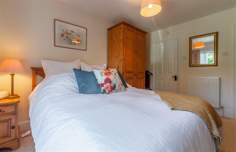 First floor:  Master bedroom with king size bed at Crown Villa, Wells-next-the-Sea