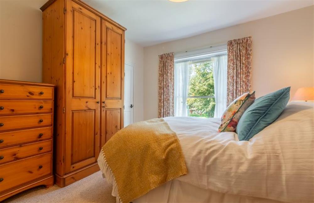 First floor:  Master bedroom with large wardrobe and chest of drawers at Crown Villa, Wells-next-the-Sea
