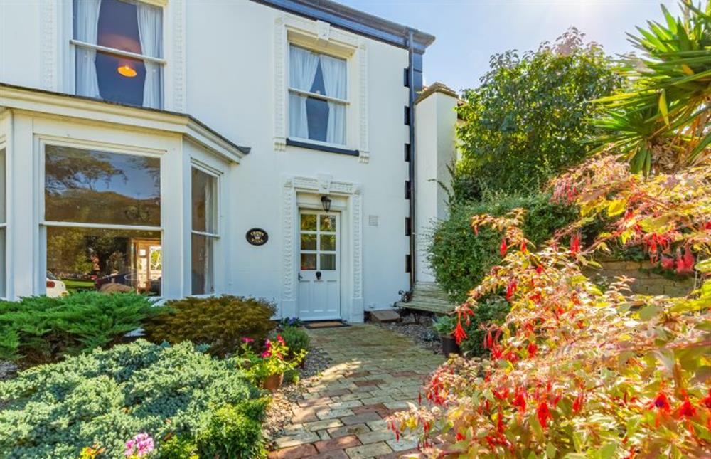 Front elevation:  with stunning garden with roses and flowering shrubs at Crown Villa, Wells-next-the-Sea