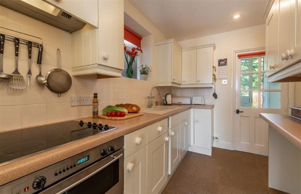Ground floor:  Galley kitchen with electric oven and hob at Crown Villa, Wells-next-the-Sea