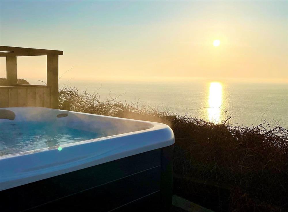 Watch the sunrise over Exmouth from your private luxury hot tub at Crows Nest in Dawlish, Devon