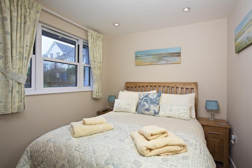 Double bedroom with wooden framed bed at Crowthers in , Dartmouth