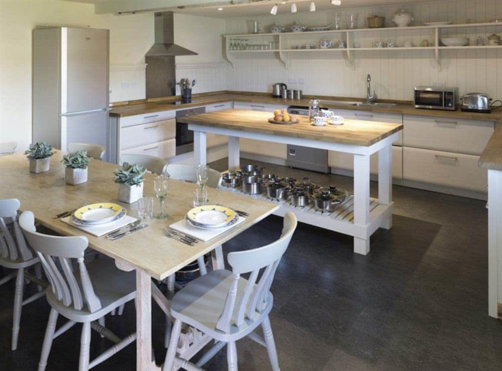 Convenient dining area and kitchen at The Long Barn, 