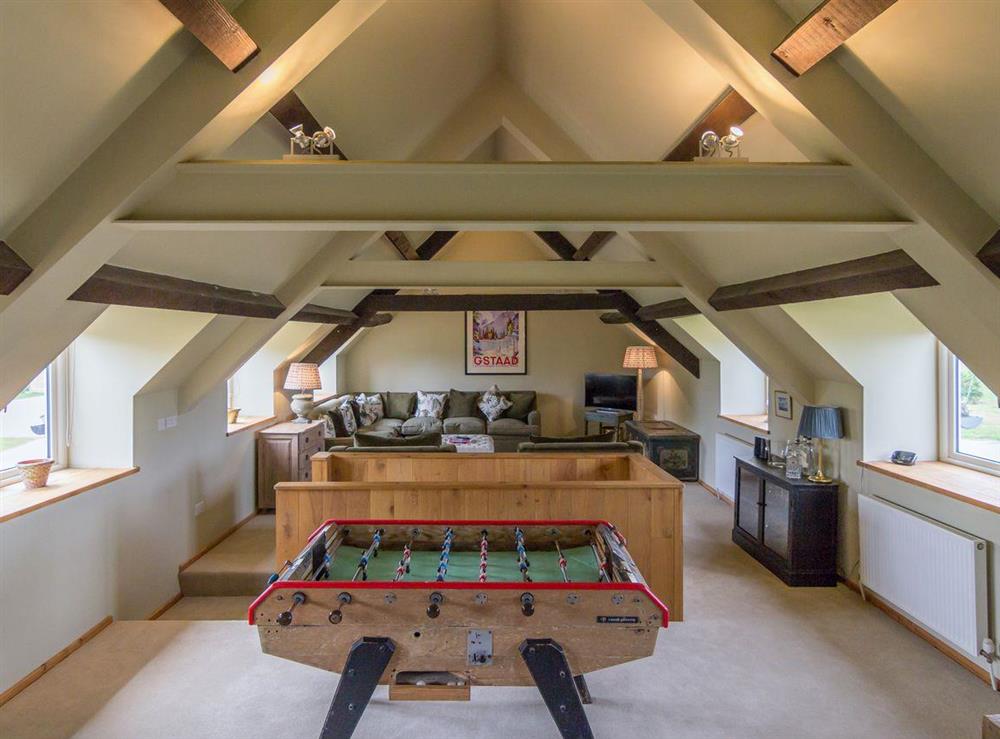 Large living space with exposed ceiling beams