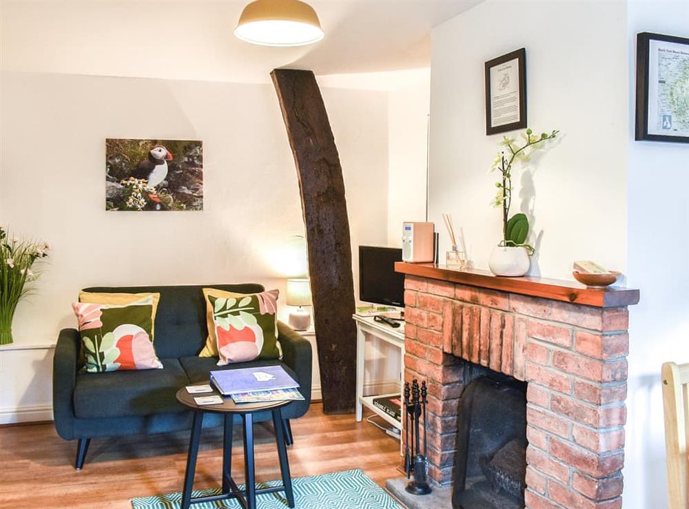 Living area at Cruck Cottage in Wombleton, near Helmsley, North Yorkshire