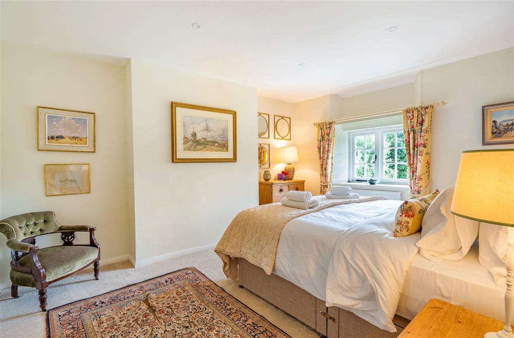 Bedroom one with 6’ super-king bed at Crumpet Cottage, Dorchester