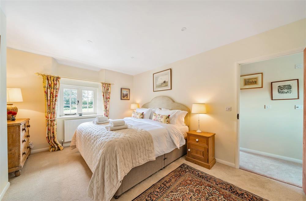 Bedroom one with it’s pretty furnishings at Crumpet Cottage, Dorchester