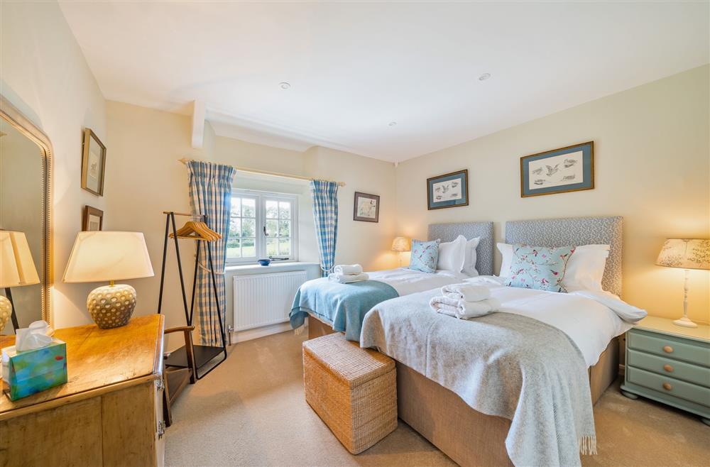 Bedroom two, with single beds available to be made up as a 6’ super-king  on request at Crumpet Cottage, Dorchester