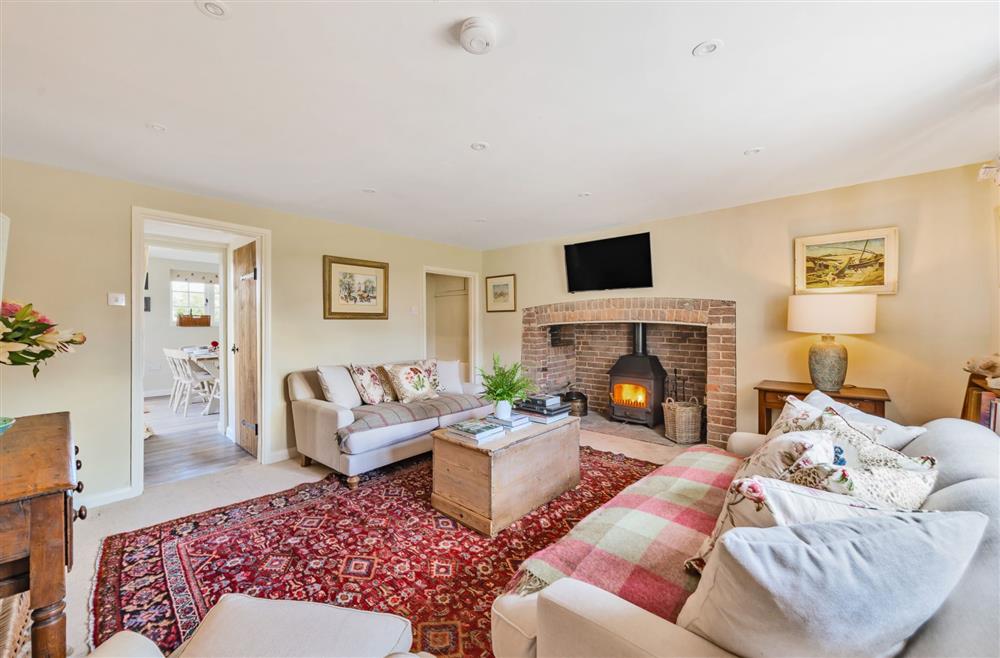 The sitting room leading through to the open-plan kitchen and dining room at Crumpet Cottage, Dorchester