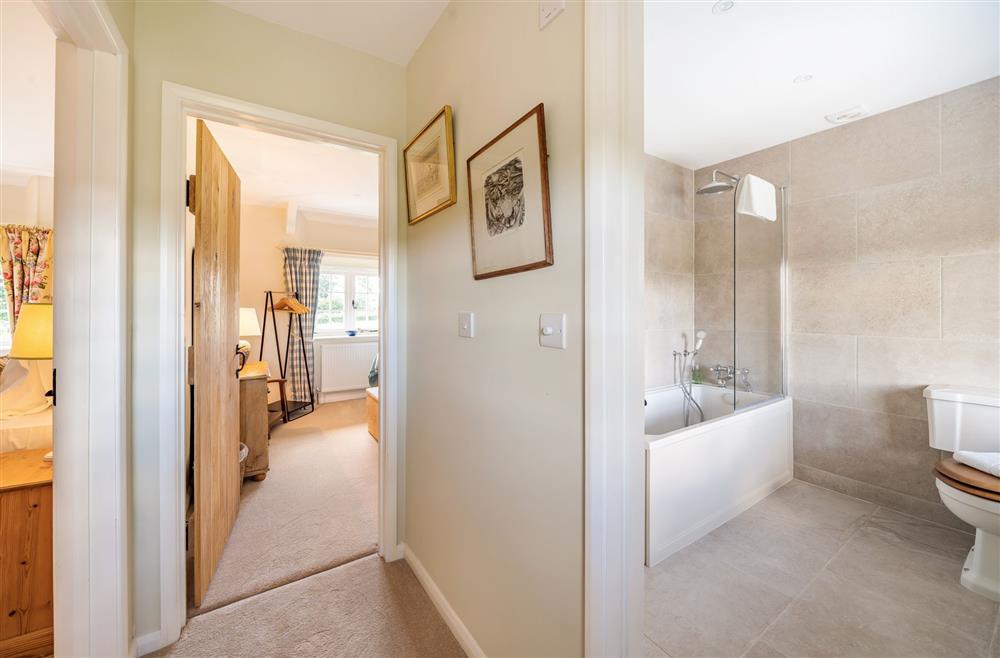 View of the twin bedroom and family bathroom at Crumpet Cottage, Dorchester
