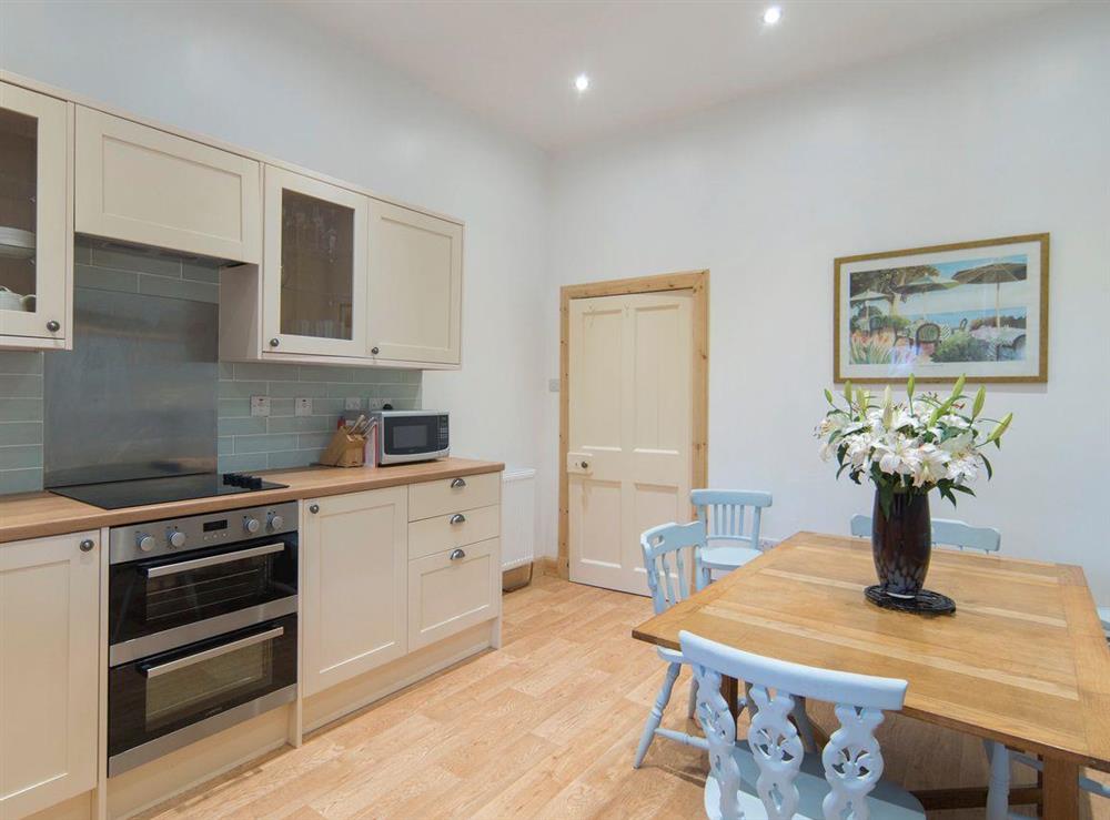 Well-equipped kitchen with convenient dining area at Cuil Lodge in Kilmelford, near Oban, Argyll