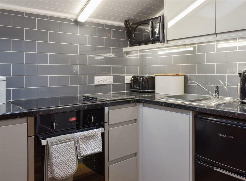 Well-equipped fitted kitchen at Cuillin View Apartment, 