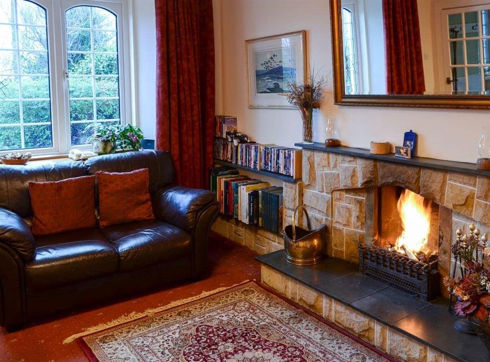 Comfortable living room with open fire (photo 3) at Culcharry Cottage in Cawdor, Nairn, Highland
