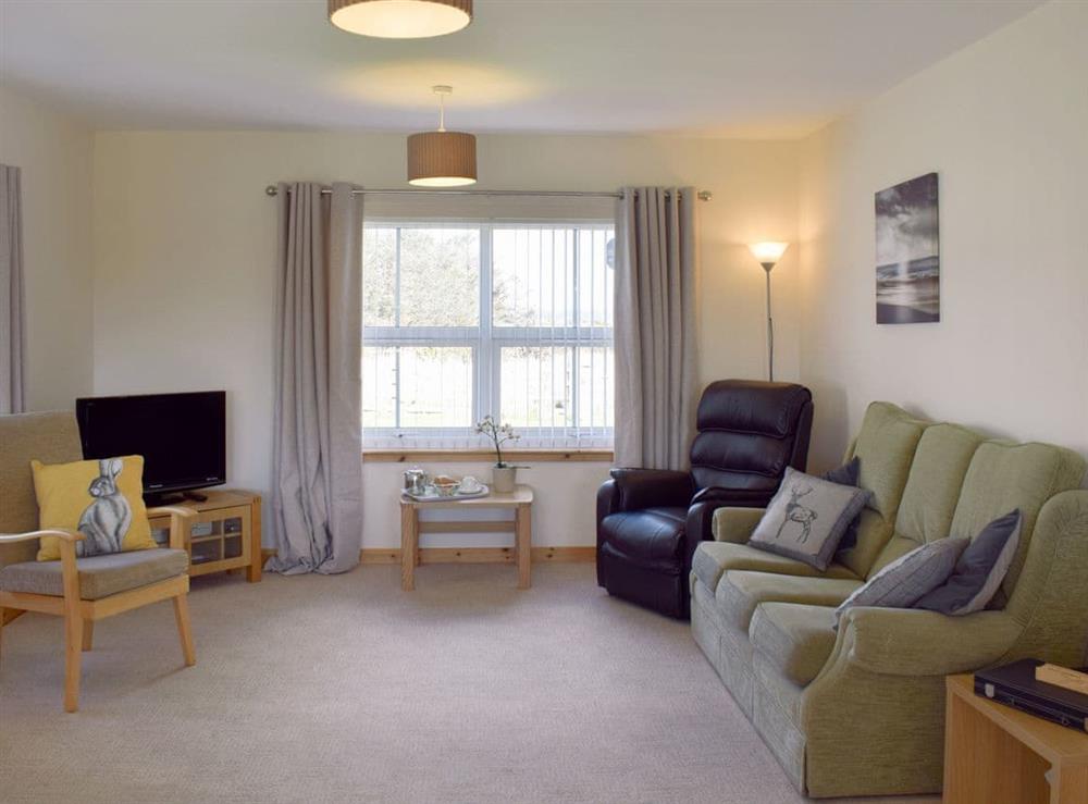 Spacious and comfortable living room at Rowan Cottage, 