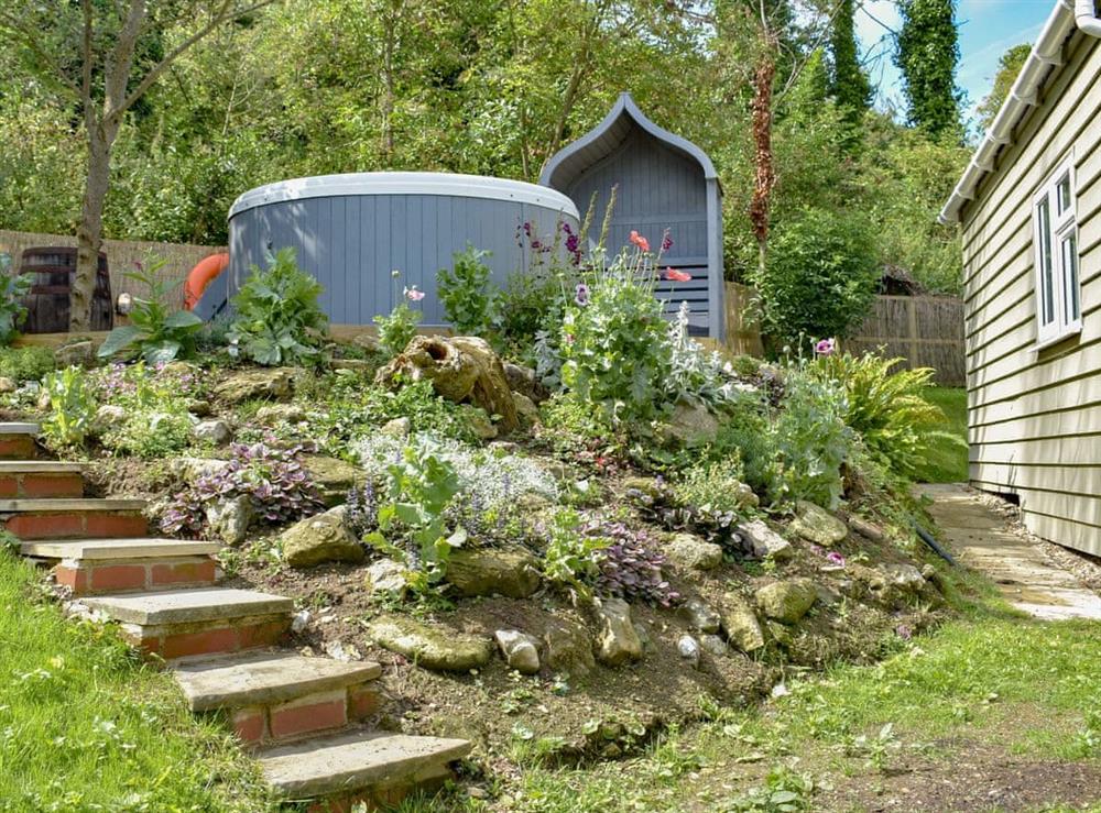 Delightful garden with hot tub at Culver Chalet in Bembridge, near Sandown, Isle of Wight