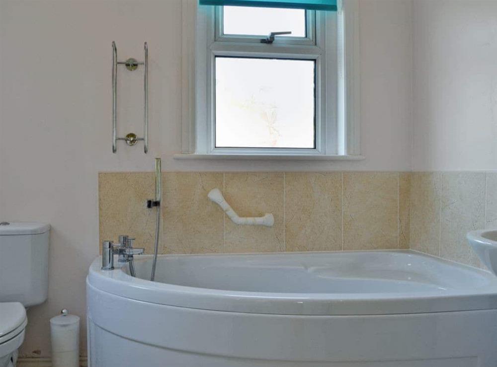 Bathroom with corner bath at Culver Cottage in Sandown, Isle Of Wight