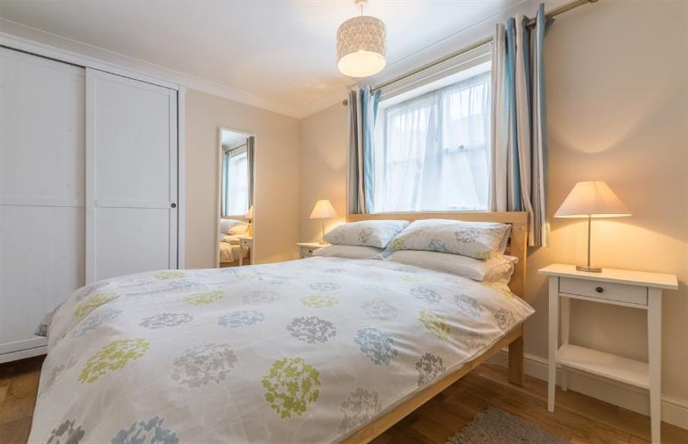 Ground floor: The bedroom has double bed and wardrobe at Curlew Apartment, Wells-next-the-Sea