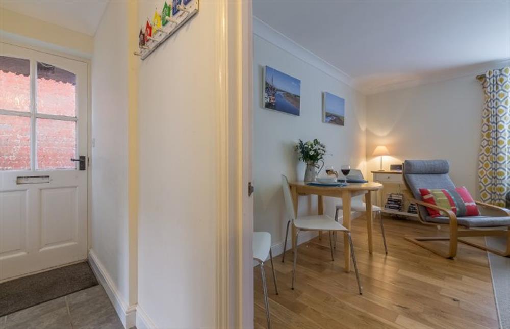 Ground floor: The hallway and sitting room at Curlew Apartment, Wells-next-the-Sea