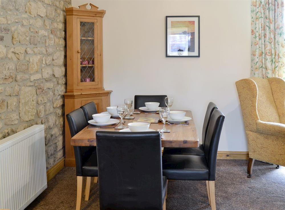 Convenient dining area within living room at Curlew Cottage in Belford, near Bamburgh, Northumberland