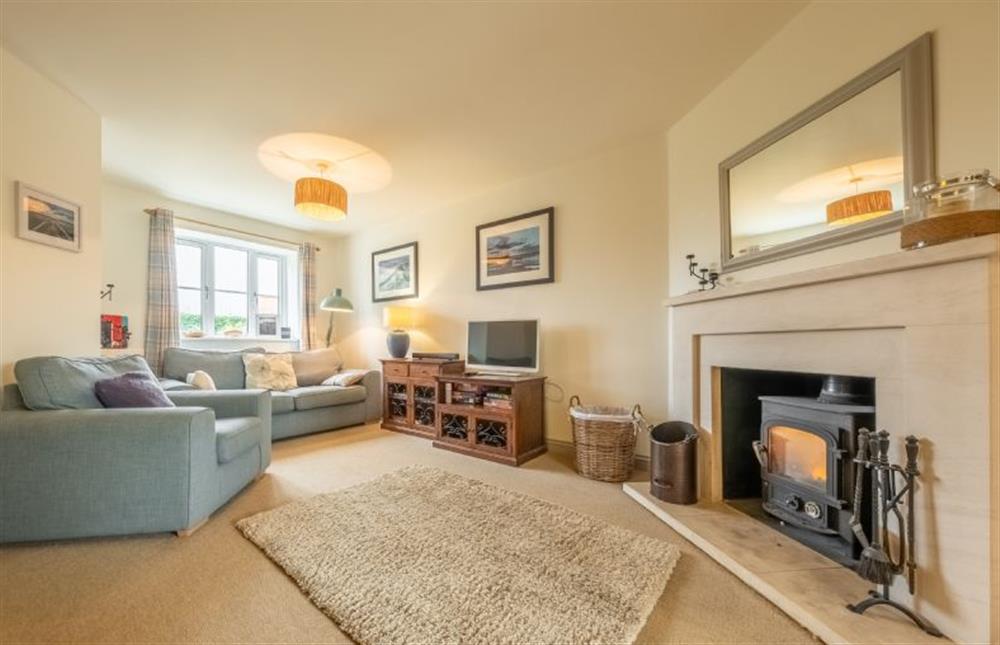 Curlew Cottage: Spacious sitting room with a wood burning stove at Curlew Cottage (Docking), Docking near Kings Lynn