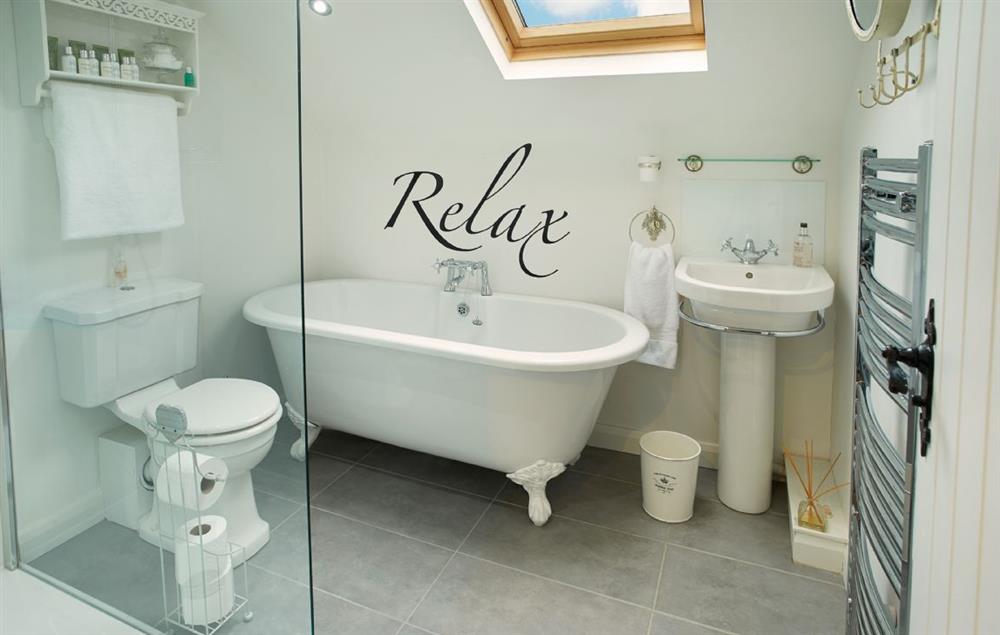 Family bathroom with spacious shower and separate, roll top bath at Curlew Cottage, Lower Peover