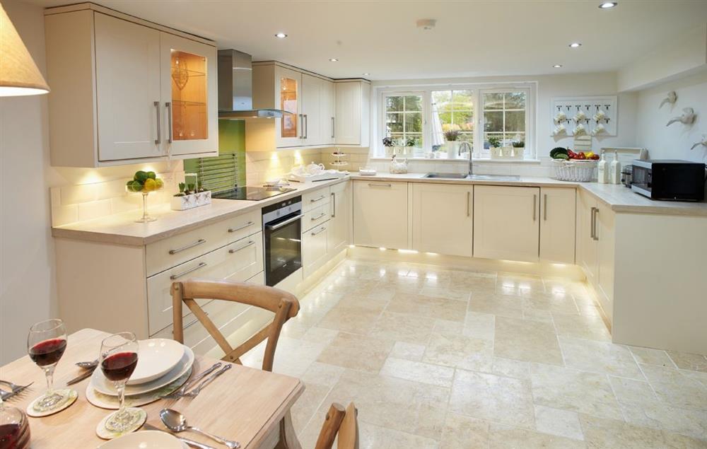 Modern and bright kitchen and dining area at Curlew Cottage, Lower Peover