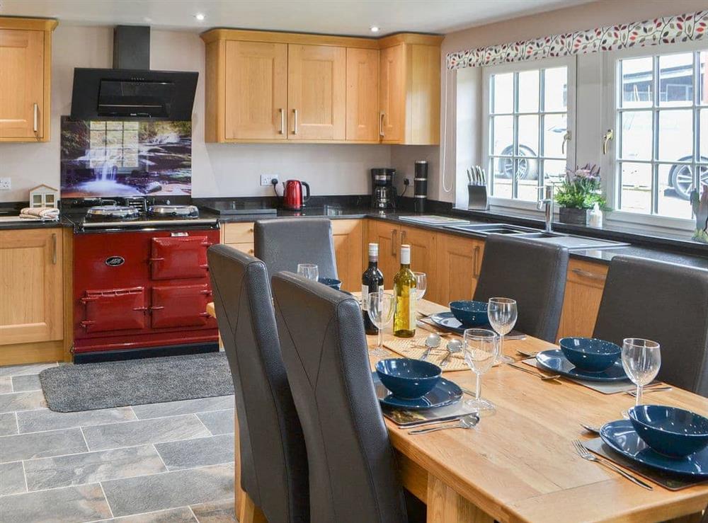 Comprehensively equipped kitchen with dining area at Curlew Cottage in Near Bellingham, Northumberland