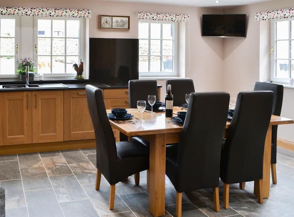 Dining area in the lovely tile-floored kitchen at Curlew Cottage in Near Bellingham, Northumberland