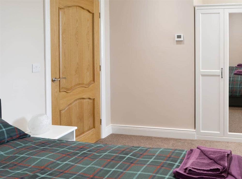 Master bedroom with ample storage at Curlew Cottage in Near Bellingham, Northumberland