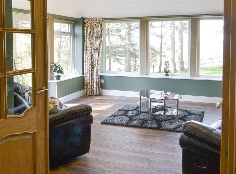 Spacious sunroom at Curlew Cottage in Near Bellingham, Northumberland