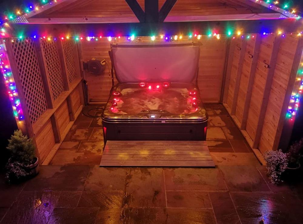 Well lit covered hot tub at Curlew Cottage in Near Bellingham, Northumberland
