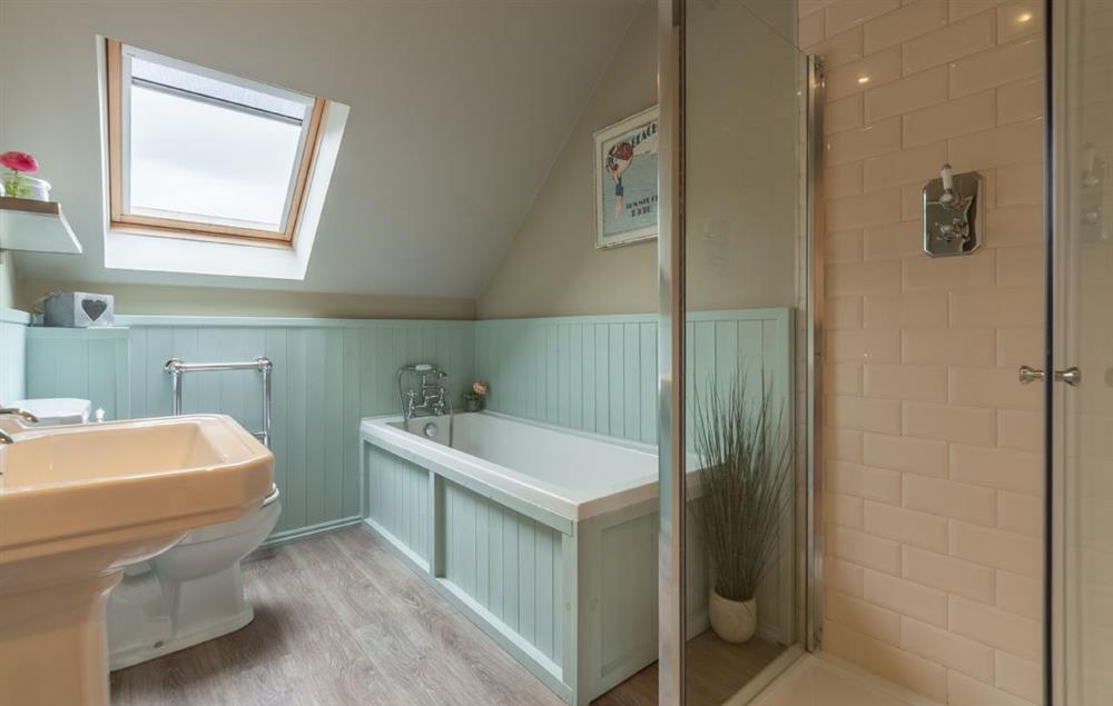 Family bathroom with bath and separate shower at Curlews Cwtch, Roserrow