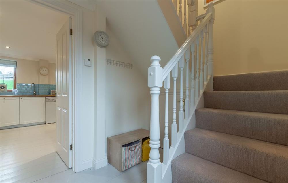 Hallway leading to first floor bedrooms at Curlews Cwtch, Roserrow