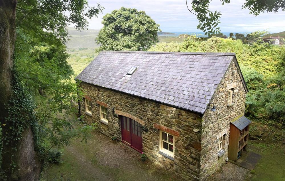 The cottage is set in a wooded hillside within its own secluded valley at Cwm Bach, Dinas Cross