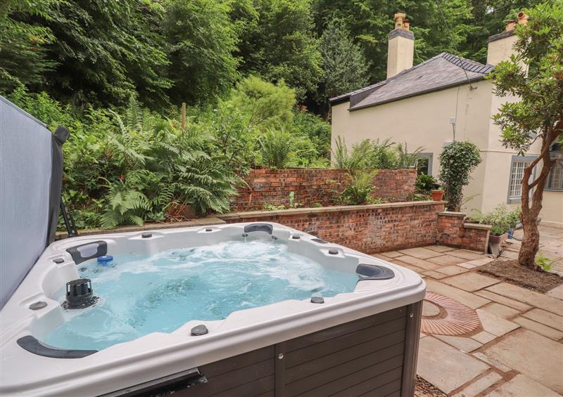 There is a hot tub at Cwmalis Hall, Llangollen