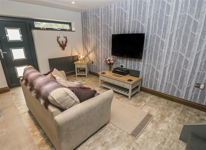 Relax in the living area at Cwtch Apartment - Pen Coed, Saundersfoot