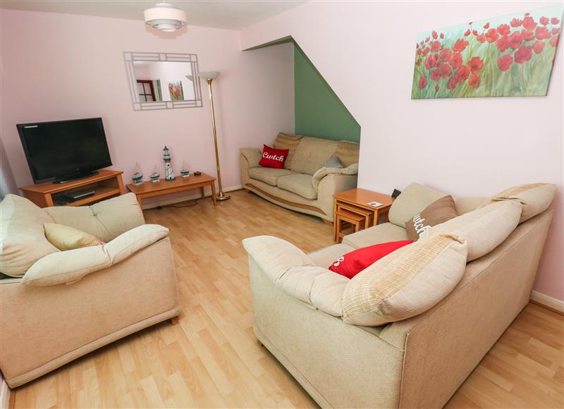 Relax in the living area at Cwtch Cottage, Broad Haven