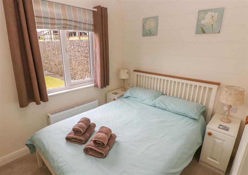 This is a bedroom at Cwtch Lodge 42, Stepaside near Wisemans Bridge